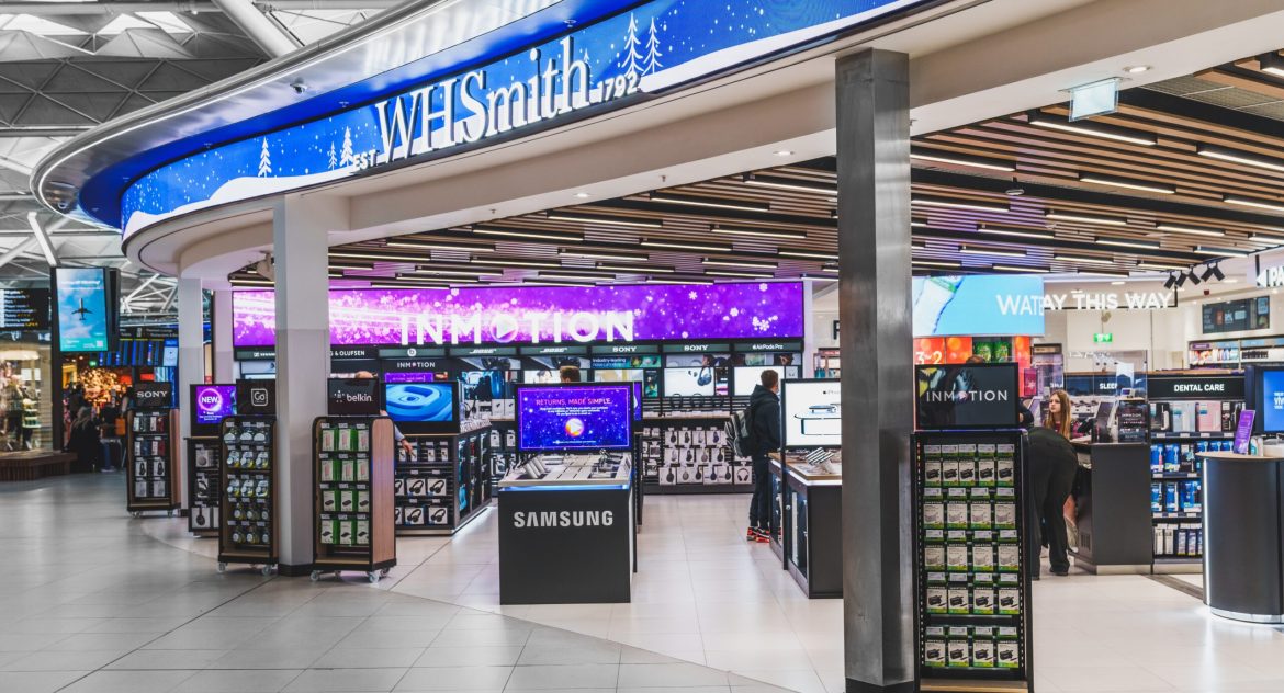 WHSmith-branded stores will disappear from UK high streets following the company’s decision to sell its entire high street division to Modella Capital for £76 million. The deal, announced on Friday, will see the 480 high street, shopping centre, and retail park locations rebranded as TG Jones, marking the end of WHSmith’s presence on Britain’s high streets after more than two centuries.The sale allows WHSmith to concentrate fully on its growing travel retail business, which has become the core driver of the company’s revenue and profit. WHSmith stores in airports, train stations, and hospitals will continue operating under their existing name.Carl Cowling, WHSmith’s chief executive, described the move as a “pivotal moment” for the company as it shifts its focus entirely to travel retail.“As our travel business has grown, our UK high street business has become a much smaller part of the WH Smith Group. High street is a good business; it is profitable and cash-generative with an experienced and high-performing management team,” he said.<blockquote>“However, given our rapid international growth, now is the right time for a new owner to take the high street business forward.”</blockquote>A new chapter for WHSmith’s high street storesModella Capital, a UK consumer and retail investment firm that also owns HobbyCraft, will take control of WHSmith’s high street business under the new name TG Jones. The company has assured customers that the stores will continue to sell the same products and services, including the Post Office, and will trade as normal during the transition.Modella stated that the name TG Jones was chosen as a “worthy successor” to WHSmith, carrying a “sense of family” and reflecting its place in local communities. The firm also emphasised its commitment to the high street, countering speculation that store closures might be considered.The deal, structured on a cash- and debt-free basis, comes amid a period of uncertainty for UK high street retailers, which have struggled against online shopping trends and rising operational costs. High-profile collapses of major chains such as Debenhams and Topshop in recent years have highlighted the challenges faced by brick-and-mortar stores.WHSmith’s transition to a global travel retailerWHSmith was founded in 1792 as a family-run newsagent and has long been a staple of the UK high street. However, over the past decade, the FTSE 250 company has pivoted towards international travel retail, expanding its presence through acquisitions such as the $400 million purchase of Marshall Retail Group in the US in 2019.The shift away from high street retail had been anticipated, with WHSmith confirming in January that it was in talks to sell the division. The company’s travel retail segment, which operates in airports, train stations, and hospitals across multiple countries, now accounts for the majority of its sales and profits.While the WHSmith brand will disappear from high streets, the company’s legacy in travel retail remains intact. Its first travel-focused store opened at London’s Euston station in 1848, a business model that has since grown to become WHSmith’s main source of revenue.With the sale expected to be completed later this year, WHSmith’s transformation into a pure travel retailer marks the end of an era for one of the UK’s longest-running high street names.The post <a href="https://invezz.com/news/2025/03/28/whsmith-to-vanish-from-uk-high-streets-after-200-year-run-following-76m-sale-to-modella-capital/">WHSmith to vanish from UK high streets after 200-year run following £76M sale to Modella Capital</a> appeared first on <a href="https://invezz.com/">Invezz</a> WHSmith to vanish from UK high streets after 200-year run following £76M sale to Modella Capital
