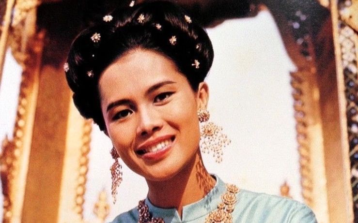 Thailand is in mourning following the death of Queen Mother Sirikit, a royal icon whose grace, philanthropy, and at times controversial influence helped shape the country’s modern monarchy. She passed away at the age of 93, the Thai Royal Household Bureau confirmed on Saturday. Sirikit had been largely absent from public life since suffering a stroke in 2012.As the nation reflects on her seven-decade-long presence at the heart of its national life, a complex and multifaceted legacy emerges.From ‘hate at first sight’ to a 70-year reignBorn in 1932 to a Thai ambassador, Sirikit Kitiyakara grew up in the privileged world of European diplomacy, studying music and languages in Paris. It was there that she met her future husband, King Bhumibol Adulyadej. Their first meeting was not auspicious. <em>(Image source: https://thailand.prd.go.th/)</em>“It was hate at first sight,” she would later recall in a BBC documentary, noting that the young king had arrived late. “Then it was love.”They were married a year later, when Sirikit was just 17. As queen consort, she stood beside Bhumibol for his entire 70-year reign, becoming a beloved figure through their extensive charitable work and high-profile international tours.A global style icon with a purposeSirikit was renowned for her elegance and impeccable fashion sense. During a landmark 1960 visit to the United States, Time magazine described her as “svelte” and “archfeminist.”<em>(Image source: https://thailand.prd.go.th/)</em>She famously collaborated with the French couturier Pierre Balmain, commissioning outfits made from traditional Thai silk. The partnership was a stroke of genius, helping to revitalize the domestic silk industry and preserve traditional weaving techniques.Her glamour always had a purpose. For over four decades, she accompanied the king on televised visits to remote villages, promoting development projects for the rural poor and cementing her image as a compassionate, maternal figure.Her birthday, August 12, was designated as Thailand’s official Mother’s Day in 1976.A quiet but powerful political influenceWhile the Thai monarchy is officially above politics, Sirikit was not afraid to exercise her considerable influence at key moments. In 1956, she served briefly as the nation’s regent. Decades later, in 1998, she used her birthday address to urge the public to support the sitting prime minister, a move that successfully undermined an opposition effort to oust him.She later became associated with the royalist “Yellow Shirt” protest movement, and in 2008, she attended the funeral of a protestor who had been killed in clashes with police, a powerful and public signal of royal backing for the movement.An enduring and revered legacyFor many Thais, Queen Mother Sirikit will be remembered as a symbol of grace, national pride, and maternal virtue. Her passing will be marked with deep reverence in a country where strict lese-majeste laws make any criticism of the monarchy, past or present, a serious criminal offense.She leaves behind her son, the current King Maha Vajiralongkorn, and a legacy that is as complex as the modern nation she helped to shape.The post <a href="https://invezz.com/news/2025/10/25/a-billion-dollar-monarchy-how-queen-mother-sirikit-put-thai-silk-on-the-global-stage/">A billion-dollar monarchy: How queen Sirikit put Thai silk on the global stage</a> appeared first on <a href="https://invezz.com/">Invezz</a> A billion-dollar monarchy: How queen Sirikit put Thai silk on the global stage